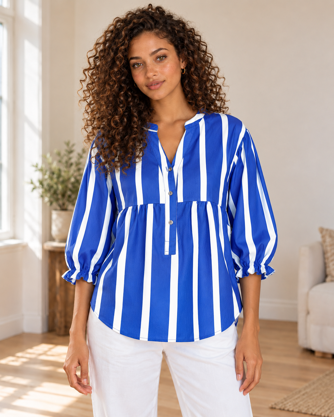 Striped Blouse in Blue, same hero model and background, pose 1