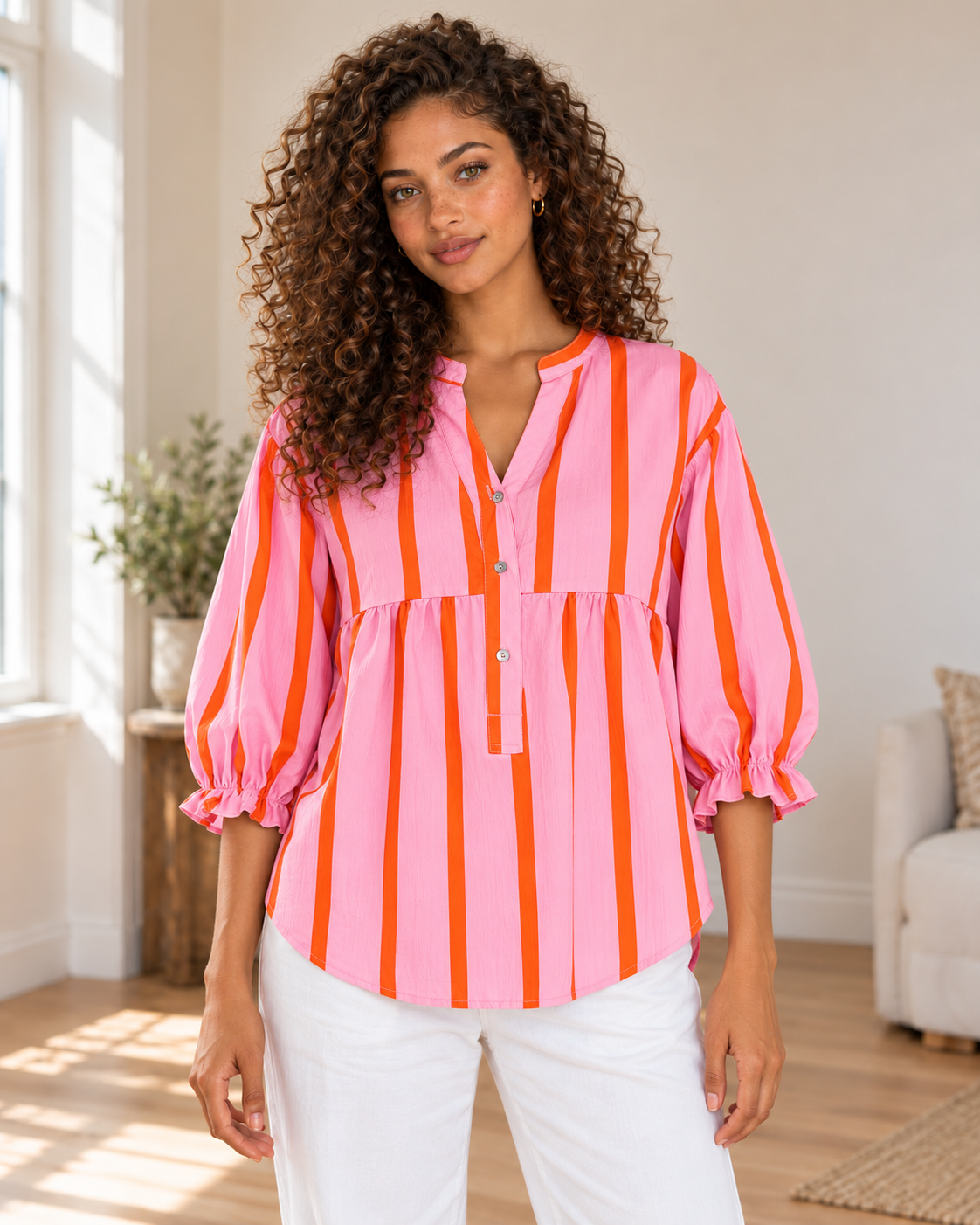 Striped Blouse in Pink, same hero model and background, pose 1